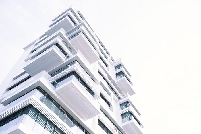 “white concrete building” by Grant Lemons on Unsplash